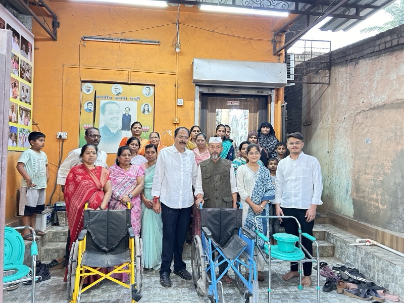 Community members gathered with mobility aids at a local programme