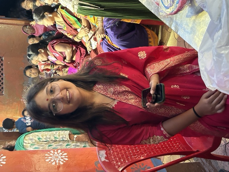 Siddhali Anup Shah seated with women during a community conversation in Phaltan