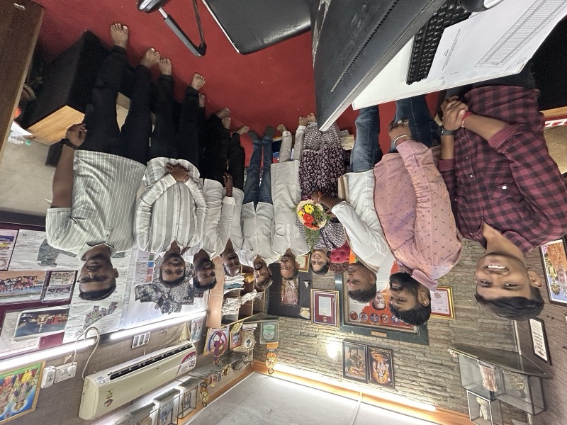 A group examining handmade products at a community exhibition