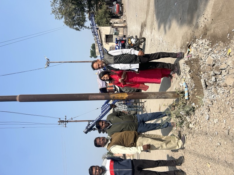 Residents and officials inspecting roadside infrastructure work